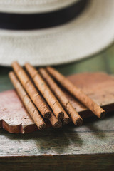 Cigars on vintage wooden table