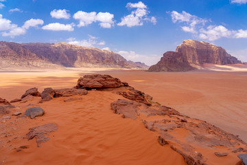 Fototapeta na wymiar Dunes of red sand in Wadi Ruma desert, Jordan