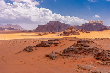 Fototapeta na wymiar Dunes of red sand in Wadi Ruma desert, Jordan