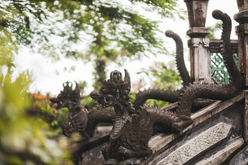 Tirta Gangga Balinese architecture, traditional statue of deity in dragon shape