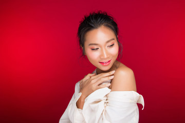 Asian tanned skin woman with strong color red lips