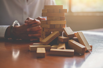 Problem Solving Business can't stop effect of dominoes continuous toppled with business team...