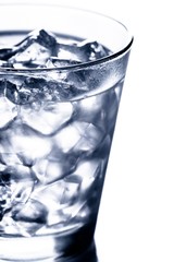 glass with water filled with ice cubes