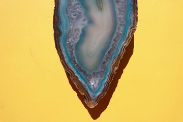 Beautiful Blue Aqua Crystal Agate on Yellow Background