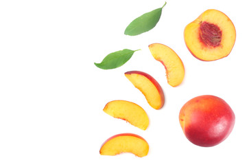 Nectarine with green leaf and slices isolated on white background. top view