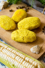 Mchadi - traditional white corn flour Georgian bread with turmeric powder. Samegrelo region cornbread. Vegan crusty bread, vegetarian healthy food.