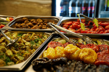 Street food on night outdoor market. Spicy, seafood, veggie, vegetable meal