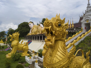 Aerial View of Buddhist Temple Wat Phra That Suthon Mongkon Khiri features beautiful architectures that are inspired by the ancient, traditional ordination hall (Ubosot) and reclining Buddha statue