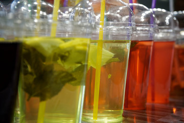 Beverage colorful drinks on the street market, chilled fruit drinks with ice in Asia.