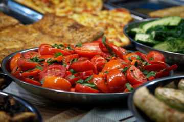 Street food on night outdoor market. Spicy, seafood, veggie, vegetable meal
