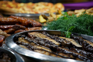 Street food on night outdoor market. Spicy, seafood, veggie, vegetable meal