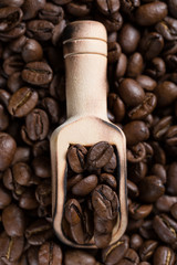 Grains of coffee in a scoop