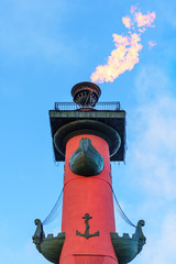Rostral column with fire on Vasilyevsky island Spit Strelka. Saint Petersburg, Russia