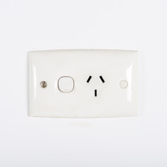 Australia electrical power outlet on white wall.