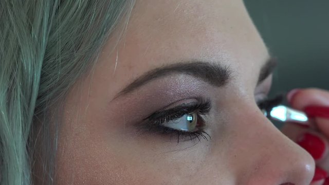 Makeup Girls. Eyeshadow & Eyeliner being applied. Closeup.