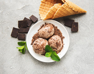 Chocolate ice cream on a stone background