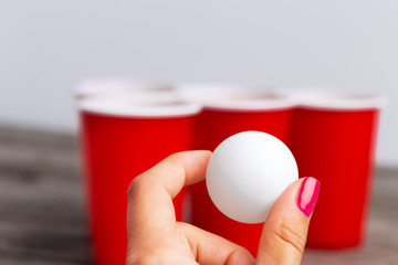 Game Beer Pong on wooden table