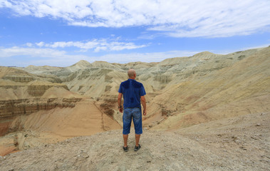 Fototapeta premium man on top of volcano in summer