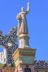 Figure of woman of collective farmer on a blue sky background on a roof of pavilion Kazakhstan on Exhibition of Achievements of National Economy (VDNH) in Moscow
