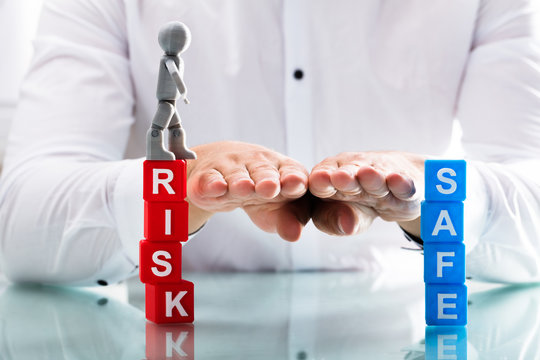 Person assisting human figure while moving from risk to safe