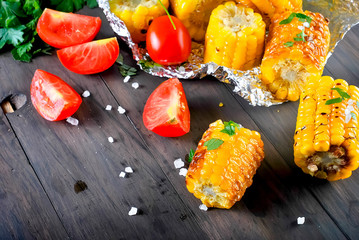 Pieces of sweet corn grilled in tin foil