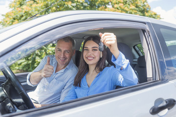 Young woman delighted having just passed her driving test
