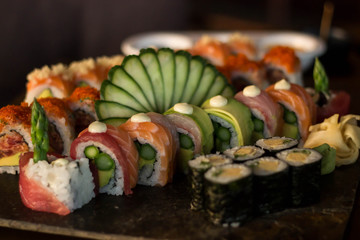 Beautifully designed sushi set of rolls on a wooden board