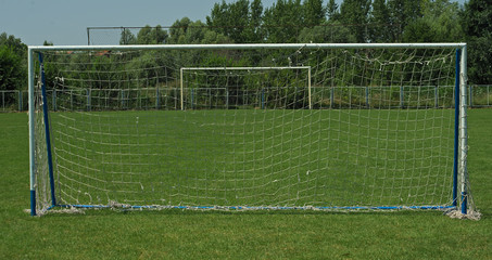 Fototapeta premium View on two goals on football field, on in front and second in background