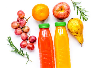 colorful plastic bottle with fruit on white background top view 