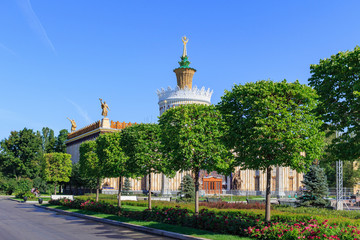 View of pavilion Ukrainian SSR on a background of green trees on Exhibition of Achievements of National Economy (VDNH) in Moscow on a sunny summer morning