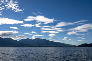 Fototapeta na wymiar White clouds over Lake Manapouri