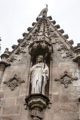 Obraz premium Barcelona, Spain - May 10, 2018: Sculpture of Jesus in gothic crypt in Poblenou Cemetery. Peaceful but macabre, cemetery of Poblenou is today home to incredible sculptures, haunting, yet beautiful.