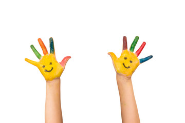 Smile, happiness and fun concept. Happy kid shows painted hands