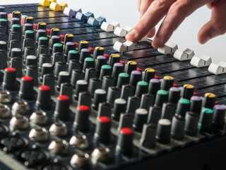 Dj working on professional mixer in audio studio
