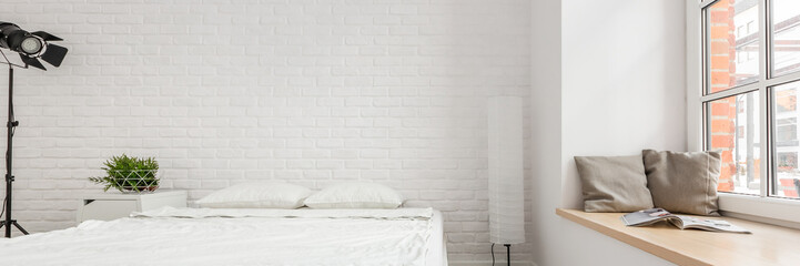 Bedroom with brick wall - obrazy, fototapety, plakaty