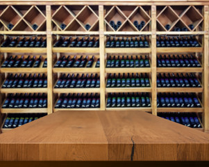 Wood table with blured background wine bar, for your photo montage or product display. Space for...