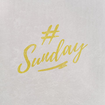 # Hashtag Sunday written on textured grey background