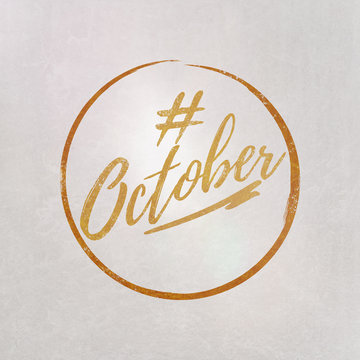 # Hashtag October written on textured grey background