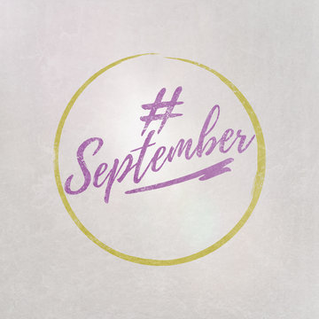 # Hashtag September written on textured grey background