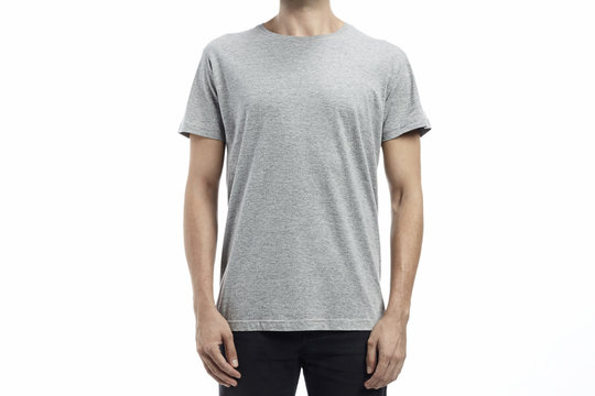 Man wearing a printable tshirt in grey for mockup over white background