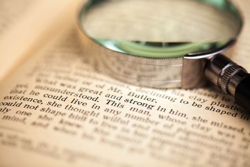 Loupe on Open Old Book - Close Up