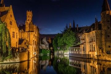 Fototapeta na wymiar Reflections in canal in Bruges, Belgium during the night