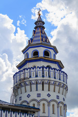 Izmailovo Kremlin watchtower against blue sky with clouds in Moscow