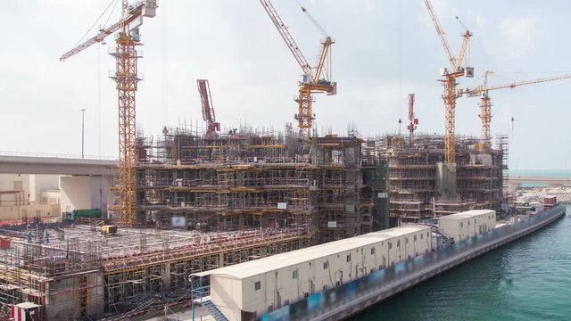 Skyscraper construction Dubai time lapse. pan up