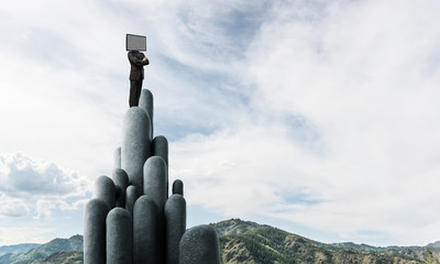 Businessman with TV instead of head.