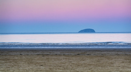 Fototapeta premium Steep Holm Island at dawn, from Weston-Super-Mare beach