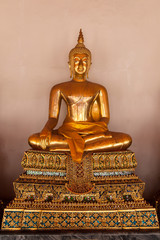 Buddha statue sitting and meditating Wat Pho  temple , Bangkok, Thailand