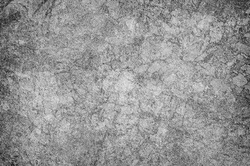 The texture is black and white in grunge style. Abstract monochrome background. Pattern of chips, cracks, scuffs, dust, stains