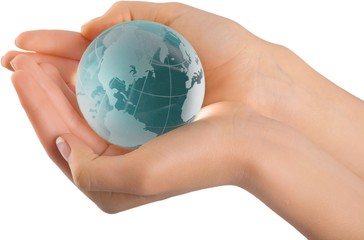 Small globe held by a person
