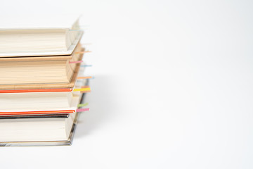 close up of book marked with placeholders on white background.